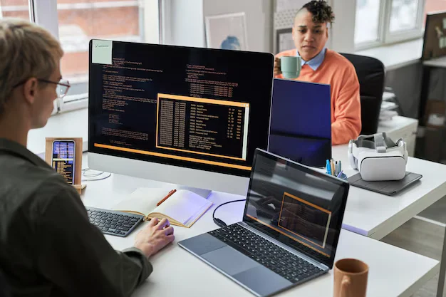 Team reviewing a software design on screen