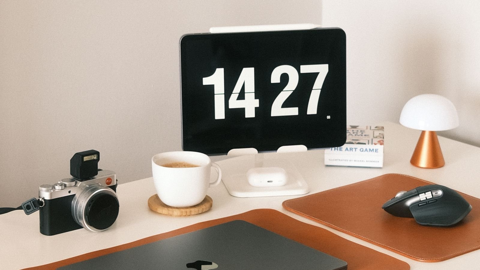 Laptop and coffee on a writing desk