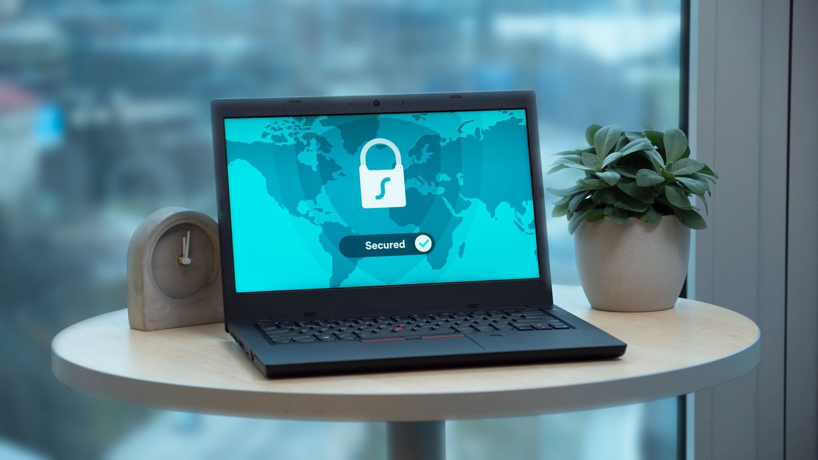 Laptop on a table displaying a cloud storage security screen
