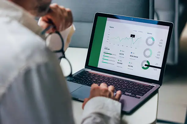 Laptop showing business metrics