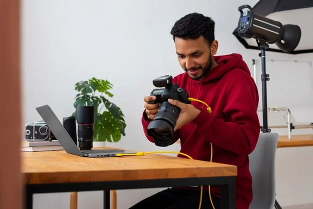Designer working at a laptop with notes