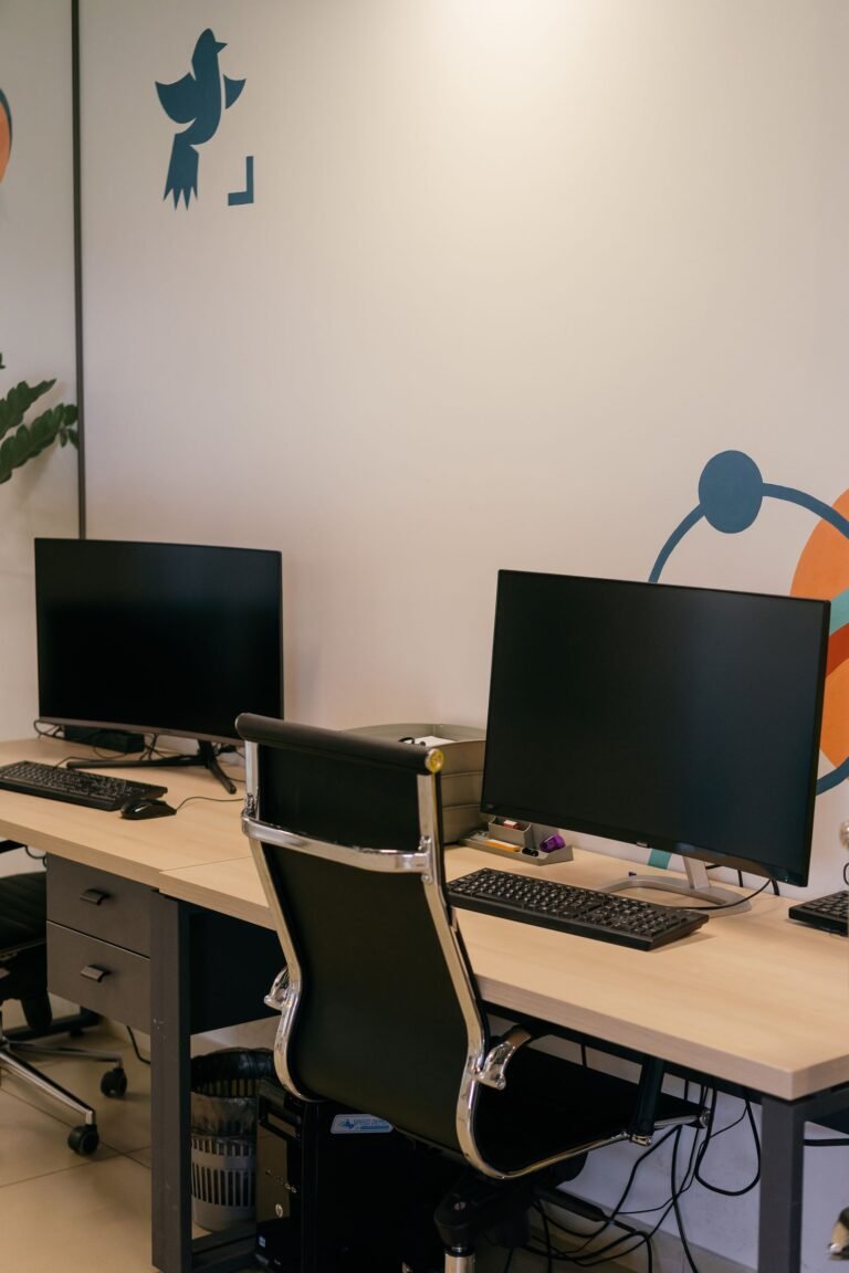 A laptop and phone side by side on a desk