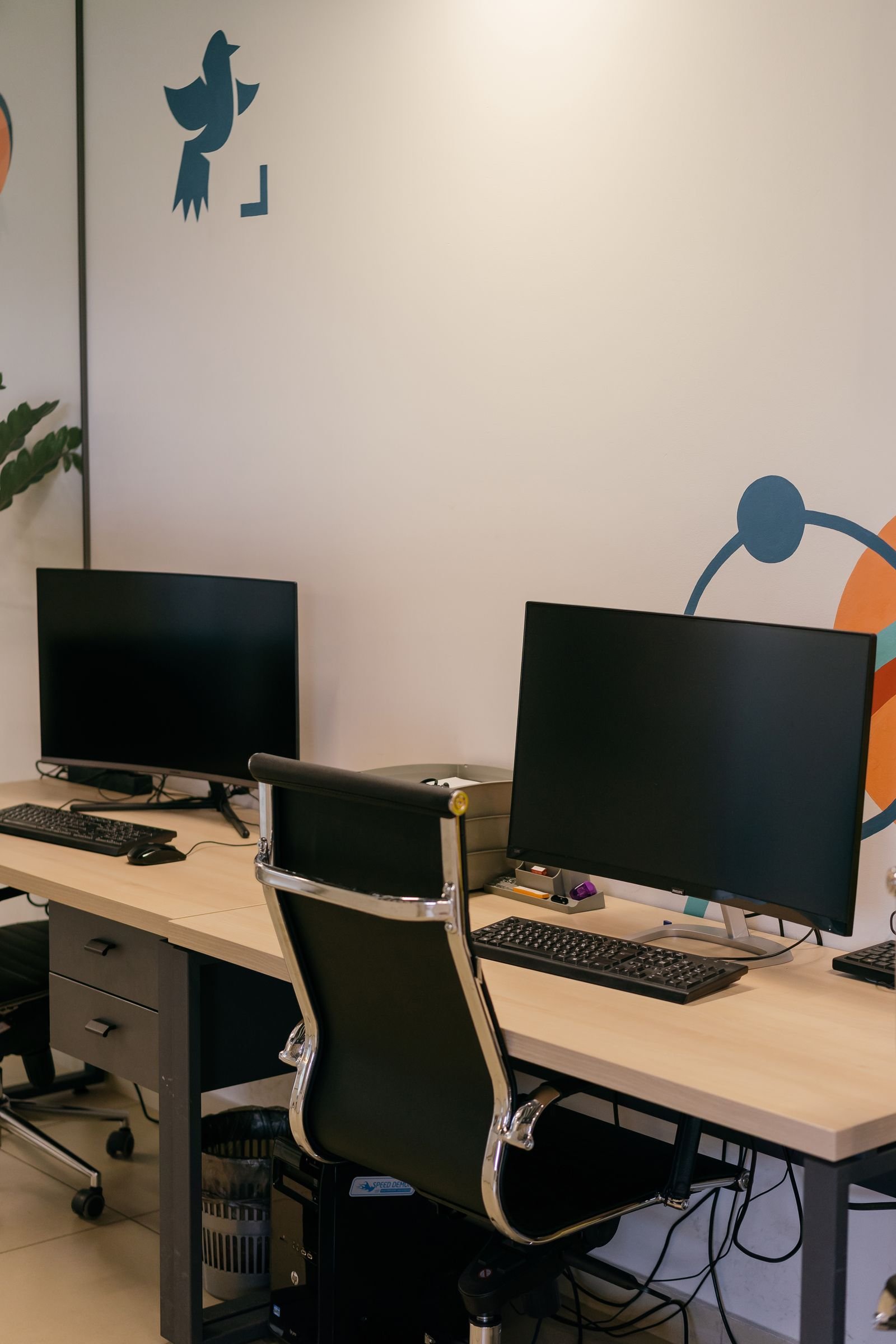 A laptop and phone side by side on a desk