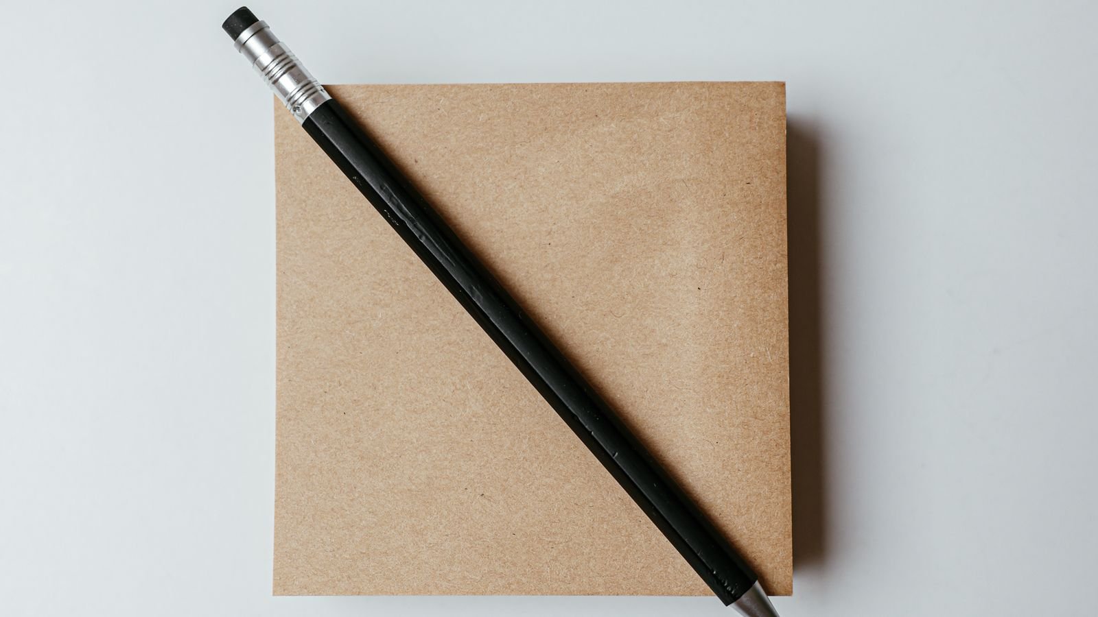 Planner and pen on a desk