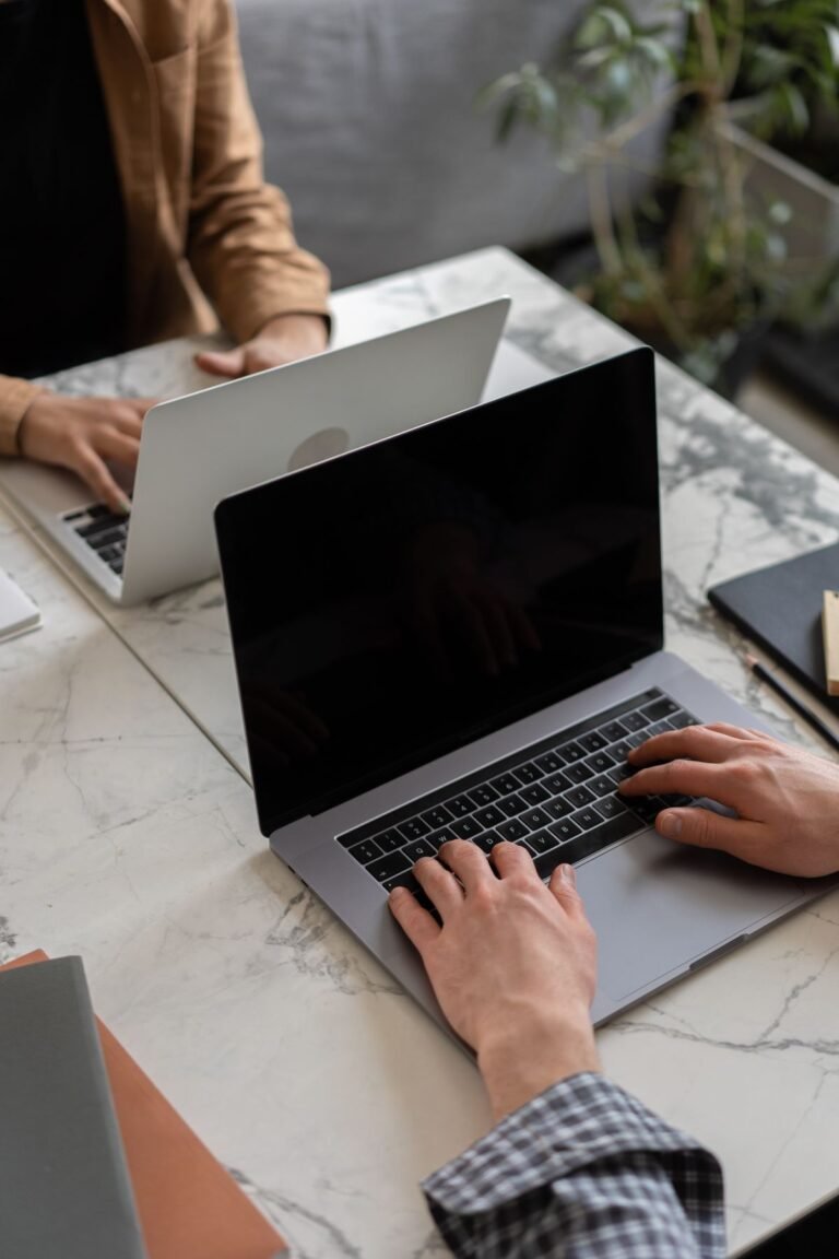Person working on a laptop away from a desk
