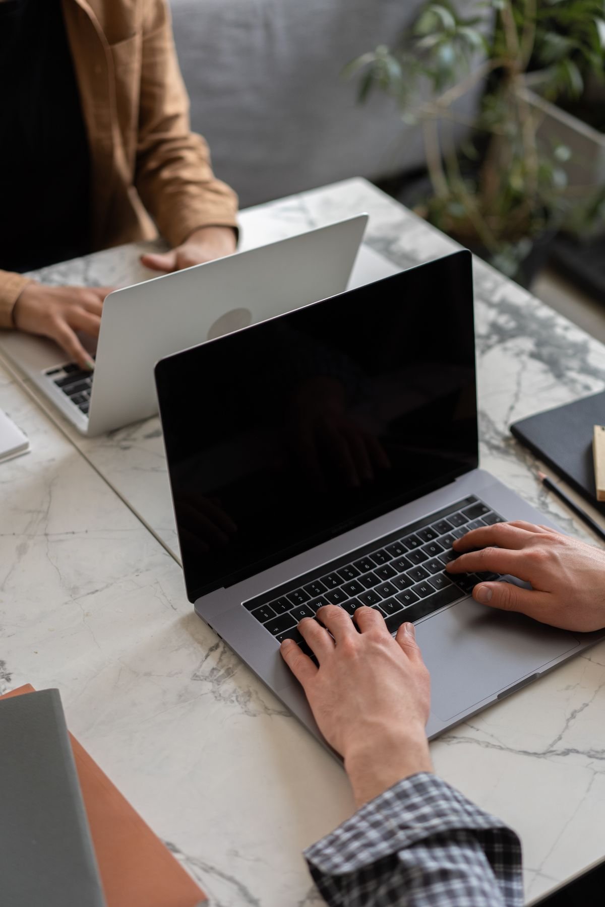 Person working on a laptop away from a desk