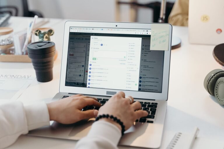 Person working on a laptop in an office