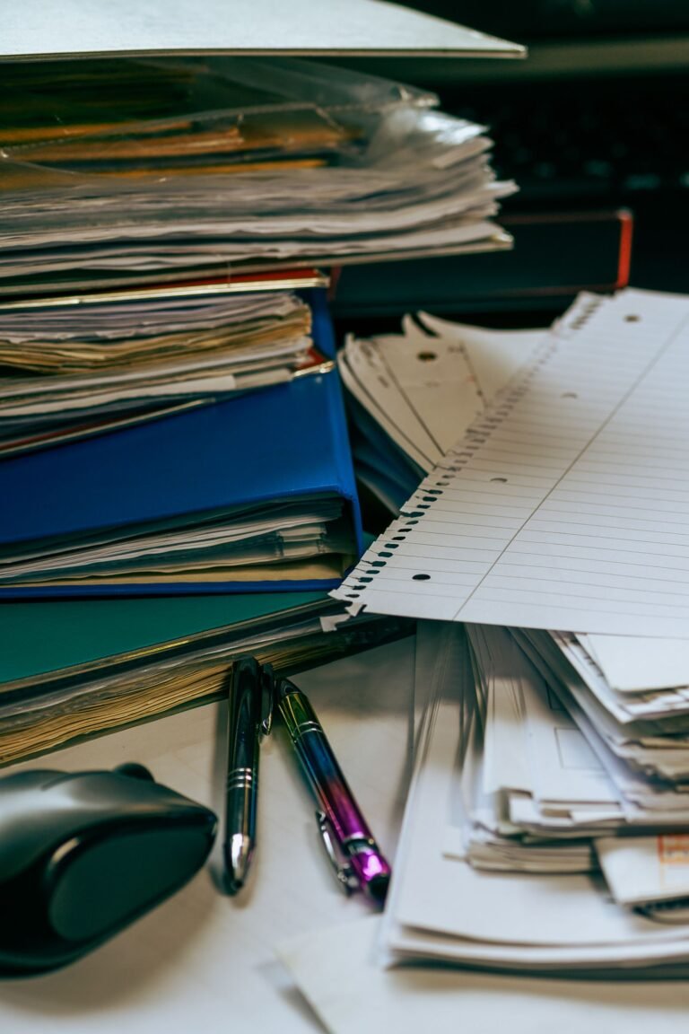 Organised desk with stacked documents