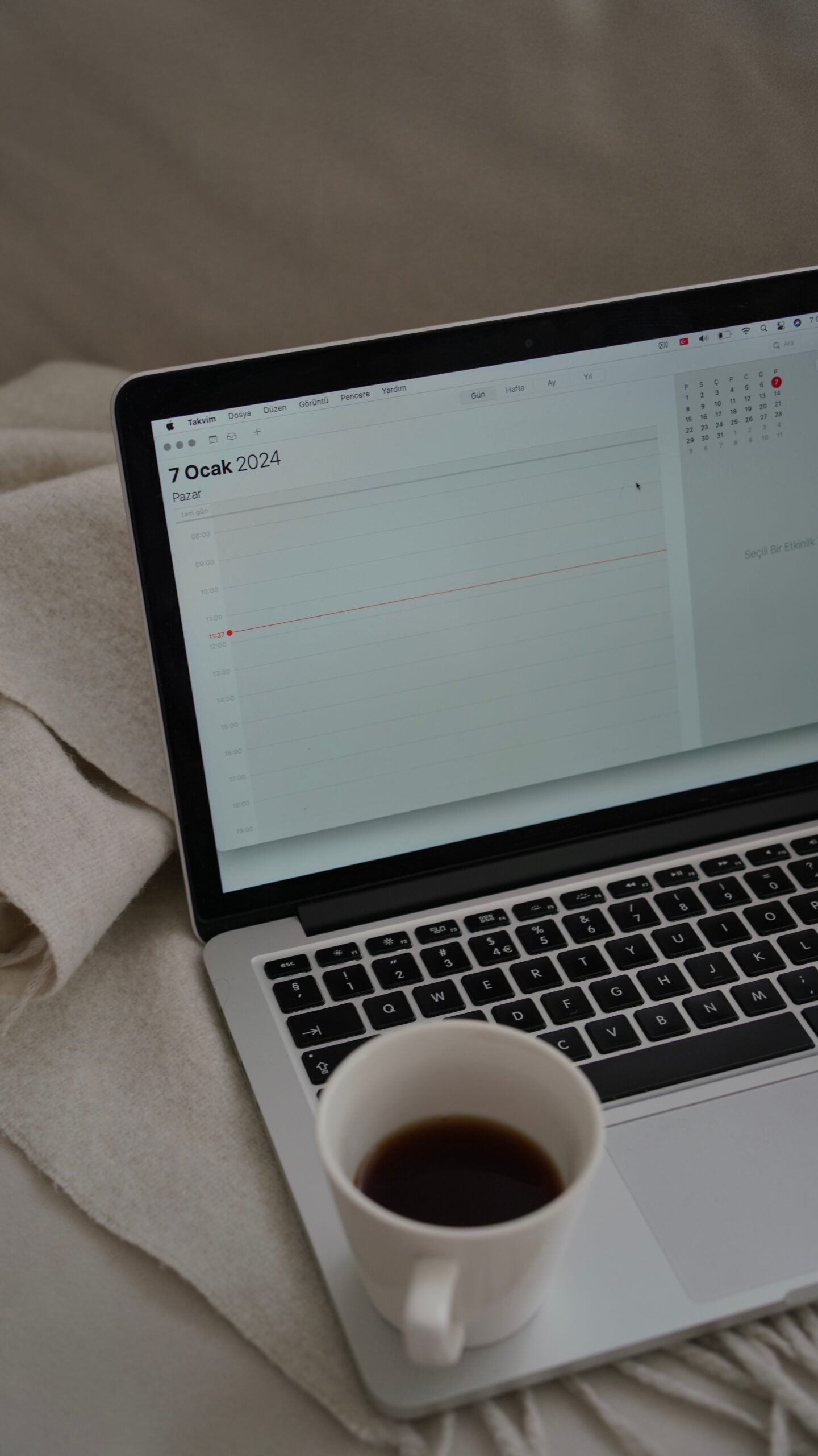 A person reviewing a scheduling app on a laptop screen